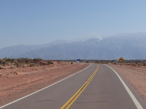 There is a wild fire in the mountains above Cafayate.